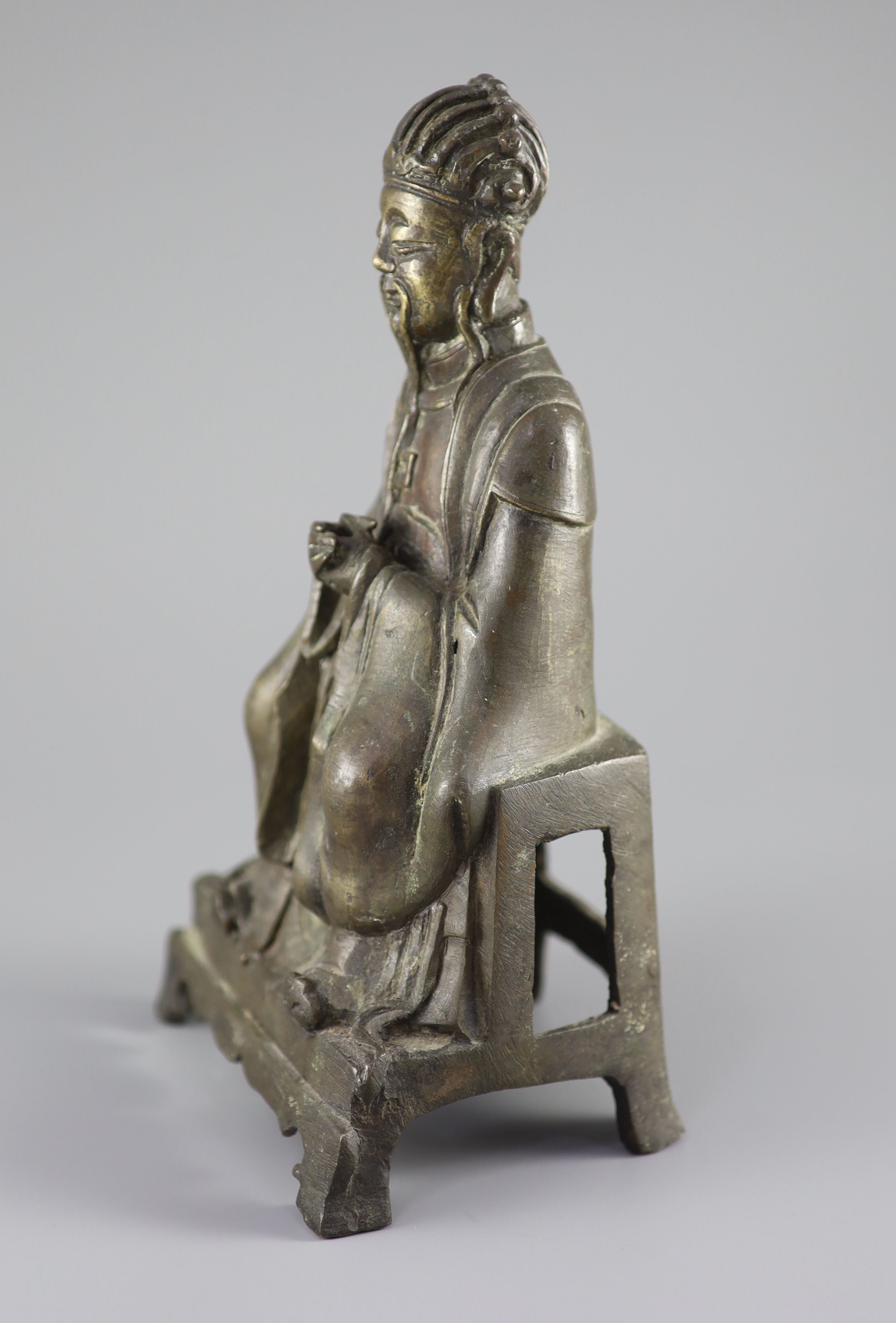 A Chinese bronze seated figure of Wenchang Wang, late Ming dynasty, 17th century, 27 cm high